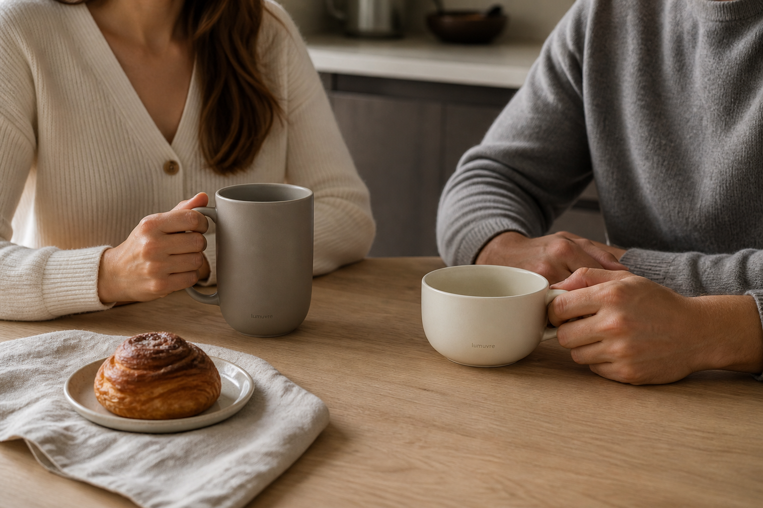 Two people sharing a quiet morning with LUMUVRE mugs